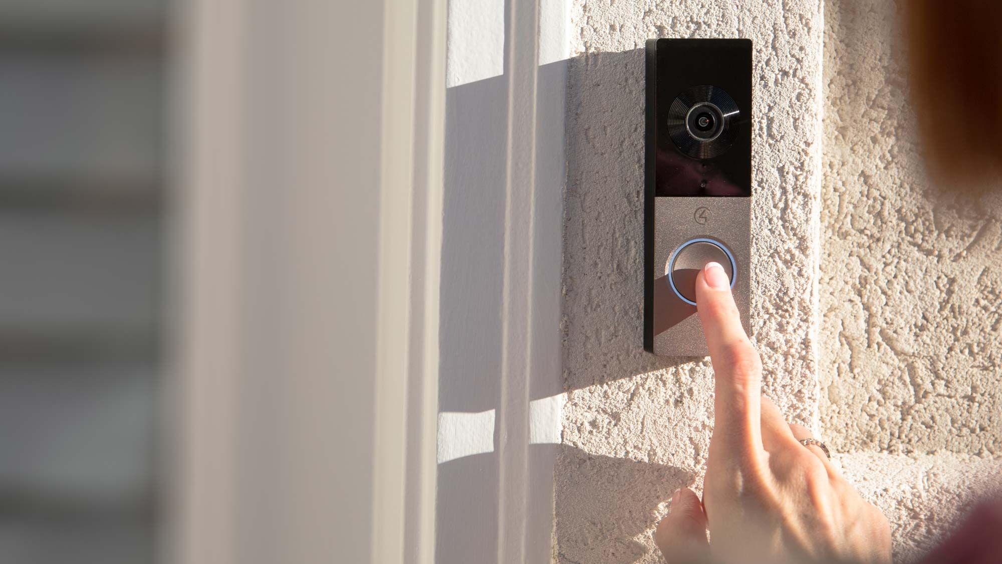 woman pressing chime doorbell Control4
