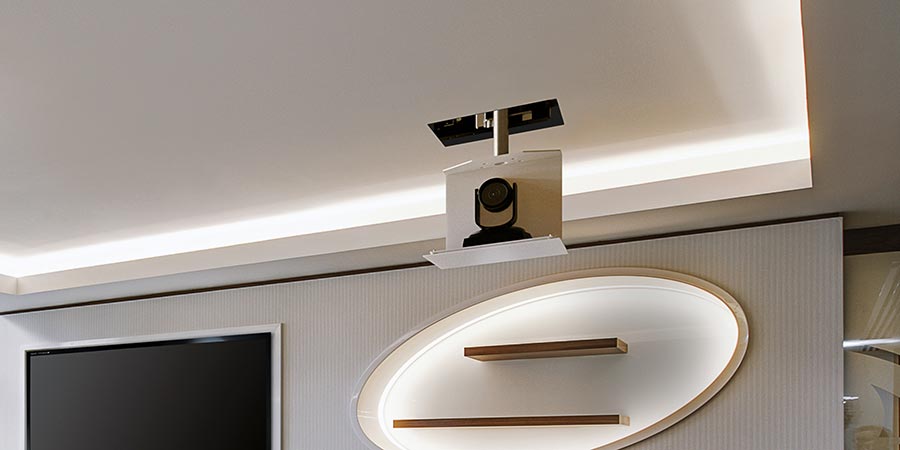 Ceiling lift lowering a camera into a modern room