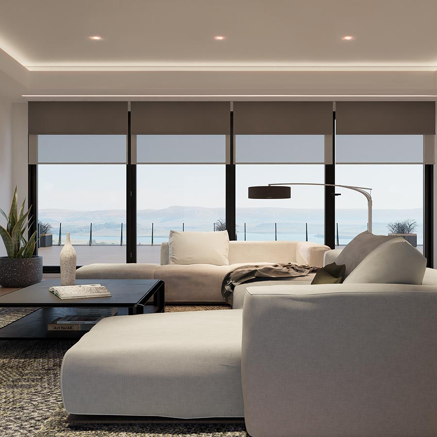 Motorised shades lowered across wide windows in a contemporary living room