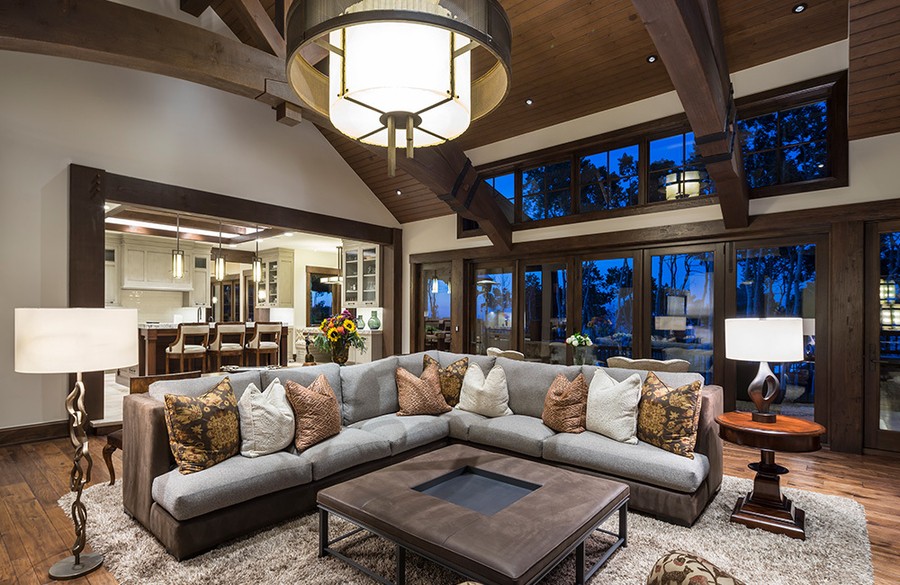 The living and kitchen area of  Park City mountain home with a smart home control system.