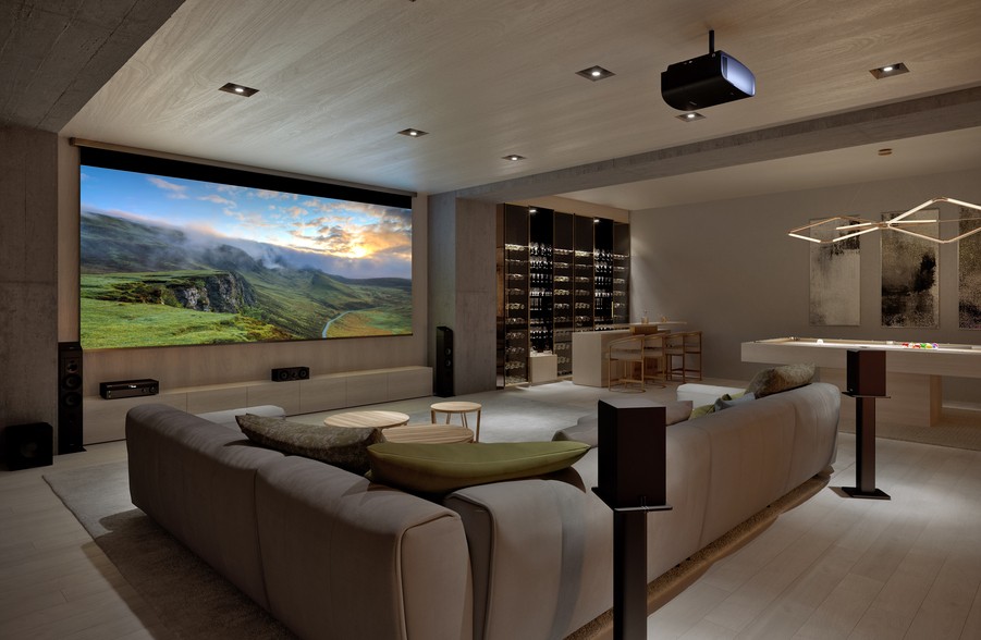 A custom home theater design with a bar and game area in a modern home.