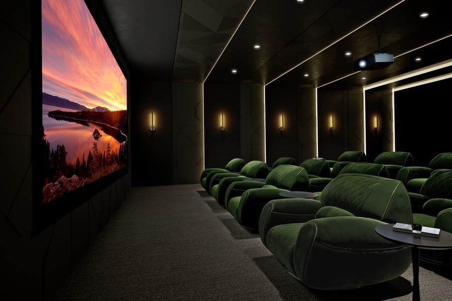 A luxurious Utah home theater with plush green seats, modern design, and LED accent lighting.