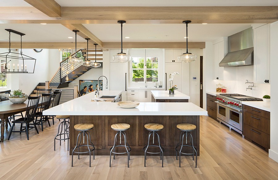 A luxurious, modern Utah kitchen with a custom lighting design.