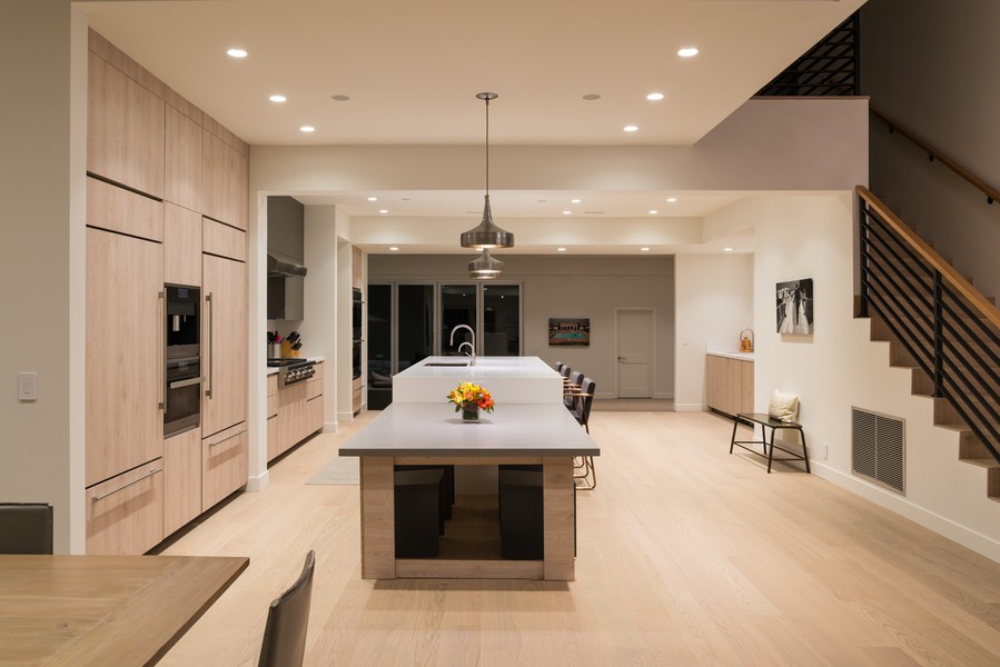 A modern Utah kitchen illuminated with Ketra tunable recessed lighting.