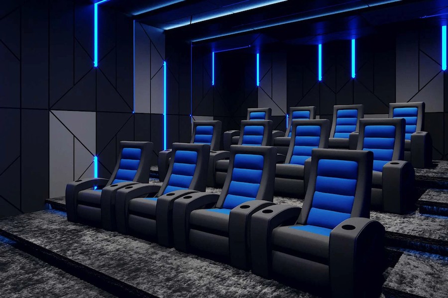 Luxury home theater with blue accented seating in a Park City home. 