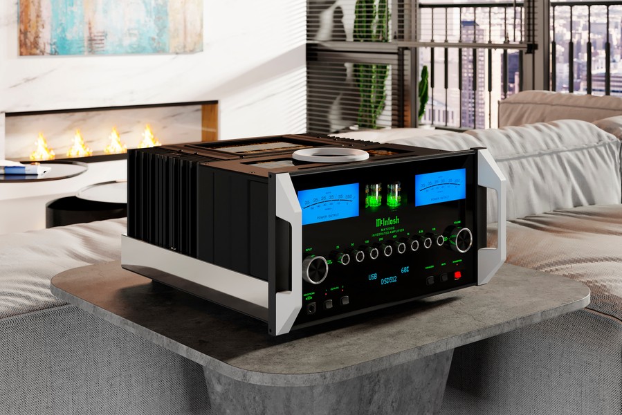 The McIntosh MA12000 Amplifier pictured on a pedestal table, with a modern living area in the background. 