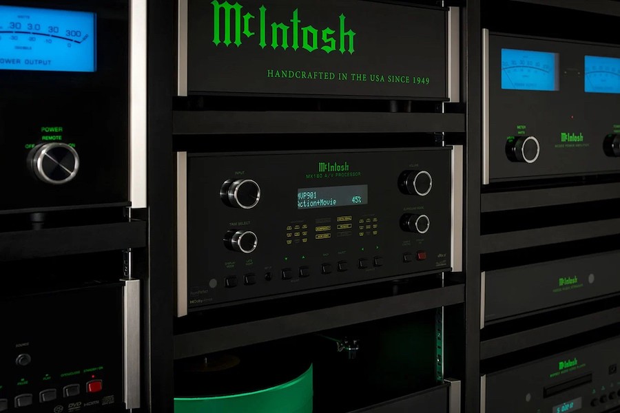 A close-up view of a McIntosh MX180 home theater processor housed in an equipment rack for a home cinema. 