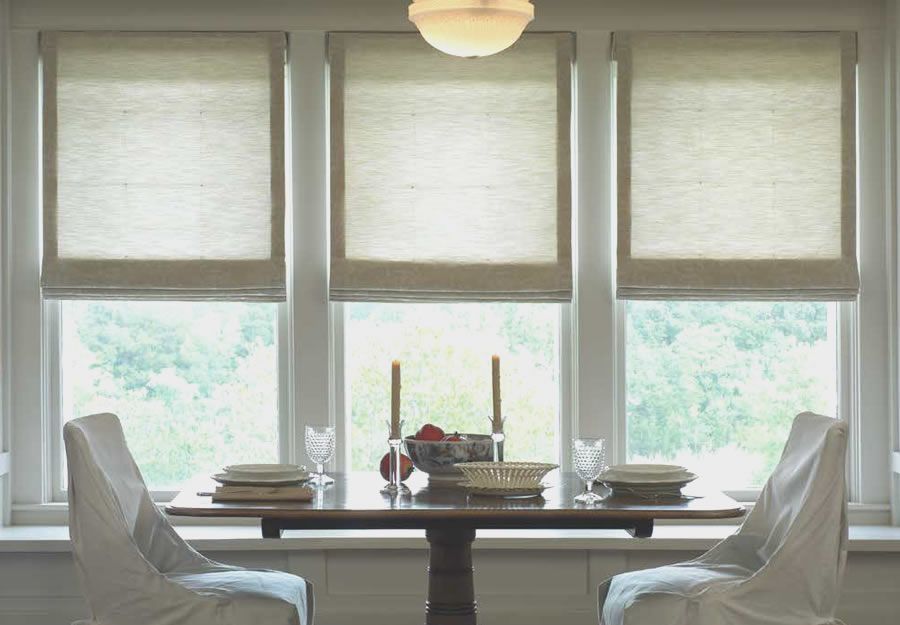roman shades by lutron in a dining room