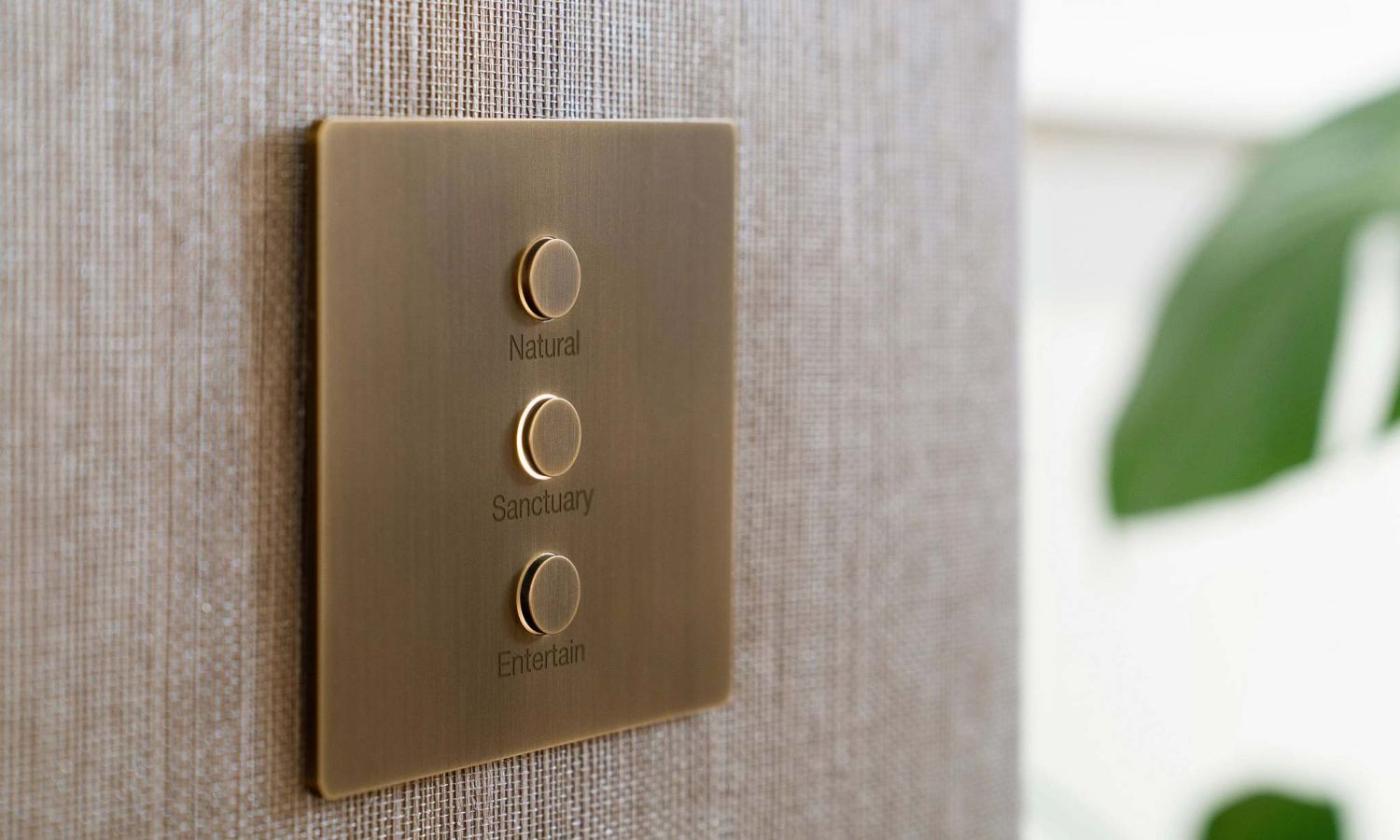 three lutron keypads in different finishes