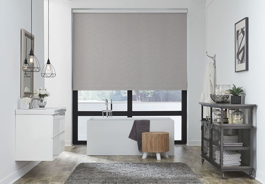 Roller shades in a bathroom lutron technology