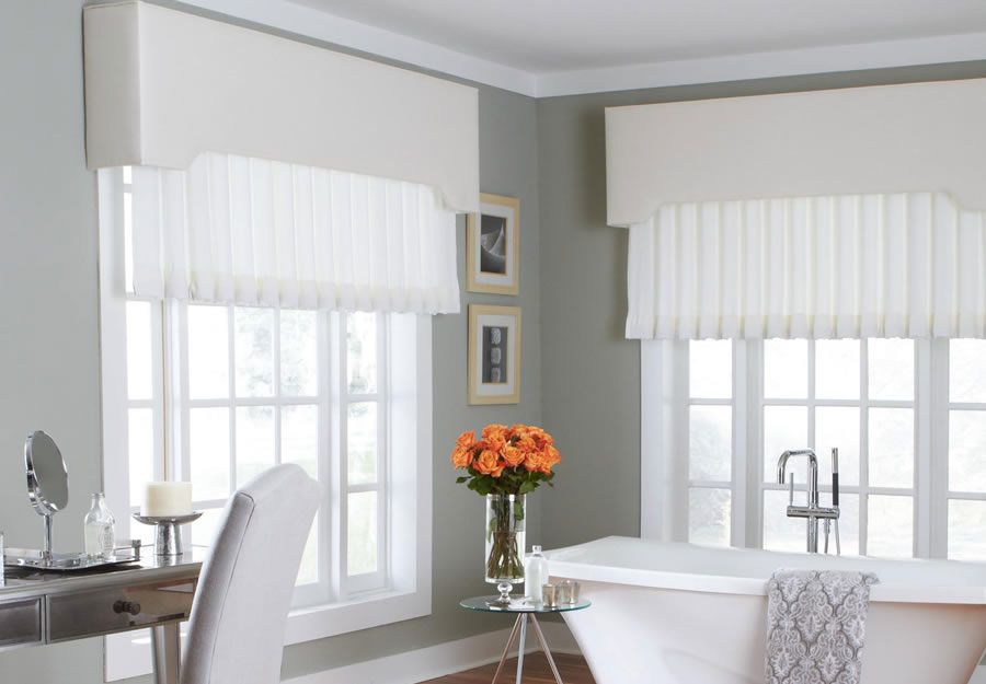 white drapes over a window in a restroom