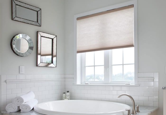 honeycomb shades by lutron in a bathroom